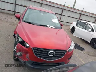 2016 Mazda CX-5 Grand Touring with VIN JM3KE2DY8G0871574, listed as a IAAI auction lot 41959686 with 95,416 mi miles and . Bid and sale history available at DreamBid. Image 12.