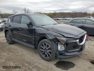 2017 Mazda CX-5 Grand Touring with VIN JM3KFBDL7H0204658, listed as a Copart auction lot 54007165 with 154,546 mi miles and Salvage Title. Bid and sale history available at carsss.com. Image 4.