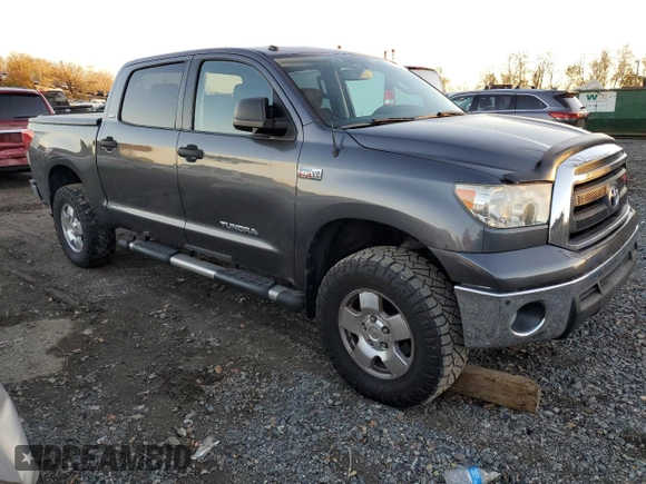 2011 Toyota Tundra 4WD Truck with VIN 5TFDY5F12BX205210, listed as a Copart auction lot 79915794 with 214,543 mi miles and Salvage Title. Bid and sale history available at carsss.com. Image 4.
