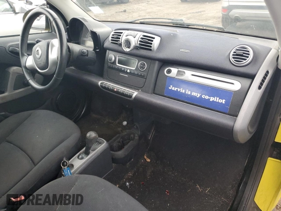 2013 Smart fortwo Pure z VIN WMEEJ3BA2DK663432, wystawiony jako Copart lot #63203755 z przebiegiem 79 786 mil mil oraz Czysty tytuł • Clean title. Historia ofert i sprzedaży dostępna na DreamBid. Obrazek 8.