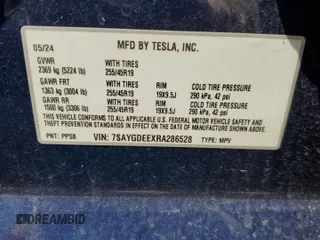 2024 Tesla Model Y Long Range with VIN 7SAYGDEEXRA286528, listed as a Copart auction lot 56321585 with Not provided miles and Salvage title. Bid and sale history available at DreamBid. Image 12.