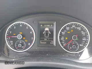 2014 Volkswagen Tiguan SE with VIN WVGAV3AX7EW549326, listed as a IAAI auction lot 42515906 with 102,221 mi miles and . Bid and sale history available at DreamBid. Image 7.