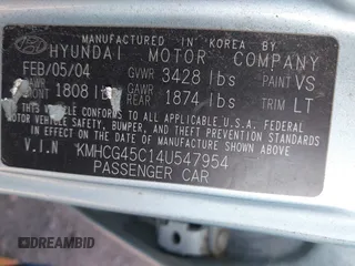 2004 Hyundai Accent GL with VIN KMHCG45C14U547954, listed as a IAAI auction lot 41350219 with 138,436 mi miles. Bid and sale history available at carsss.com. Image 9.