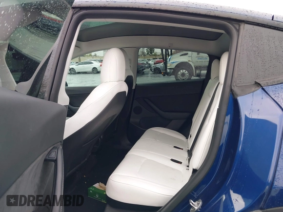 2022 Tesla Model Y Long Range with VIN 7SAYGDEE7NF409294, listed as a IAAI auction lot 41845261 with 73,116 mi miles and . Bid and sale history available at DreamBid. Image 8.