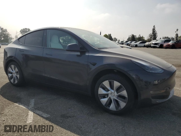 2024 Tesla Model Y Long Range with VIN 7SAYGDEE1RA266653, listed as a Copart auction lot 62277865 with 8,189 mi miles and Salvage title. Bid and sale history available at DreamBid. Image 4.