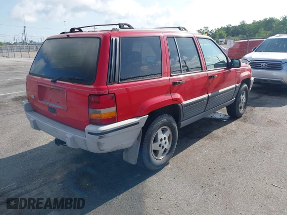 1995 Jeep Grand Cherokee Laredo with VIN 1J4FX58S9SC686074, listed as a IAAI auction lot 42451786 with 82,249 mi miles and . Bid and sale history available at DreamBid. Image 4.