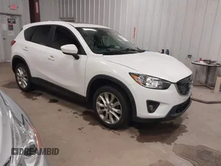 2014 Mazda CX-5 Grand Touring with VIN JM3KE4DY3E0374036, listed as a IAAI auction lot 41889030 with 162,611 mi miles and . Bid and sale history available at DreamBid. Image 1.