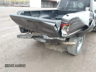 2005 Mazda B-Series Truck SE with VIN 4F4ZR47E15PM05750, listed as a IAAI auction lot 41850056 with 163,605 mi miles and . Bid and sale history available at DreamBid. Image 6.