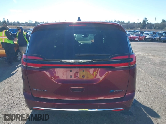 2023 Chrysler Pacifica Hybrid Limited with VIN 2C4RC1S7XPR518695, listed as a IAAI auction lot 41301401 with 24,433 mi miles and . Bid and sale history available at DreamBid. Image 16.