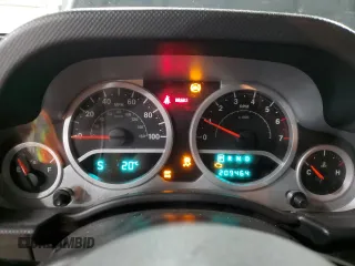 2009 Jeep Wrangler Rubicon with VIN 1J4GA64159L770895, listed as a Copart auction lot 82140864 with 209,464 mi miles and Salvage Title. Bid and sale history available at DreamBid. Image 9.
