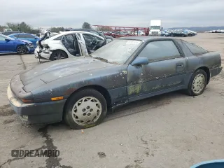 1986 Toyota Supra z VIN JT2MA70L5G0019616, wystawiony jako Copart lot #85307554 z przebiegiem 33 961 mil mil oraz Czysty tytuł • Clean title. Historia ofert i sprzedaży dostępna na DreamBid. Obrazek 1.