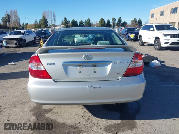 2002 Toyota Camry XLE z VIN 4T1BF30K82U506516, wystawiony jako IAAI lot #41278261 z przebiegiem 211 049 mil mil oraz . Historia ofert i sprzedaży dostępna na DreamBid. Obrazek 16.