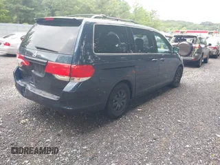 2010 Honda Odyssey EX with VIN 5FNRL3H46AB080950, listed as a IAAI auction lot 42658218 with 185,742 mi miles and . Bid and sale history available at DreamBid. Image 4.