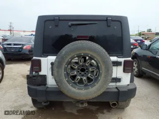 2013 Jeep Wrangler Unlimited Sport with VIN 1C4BJWDG8DL511315, listed as a IAAI auction lot 42004971 with 136,630 mi miles. Bid and sale history available at carsss.com. Image 16.