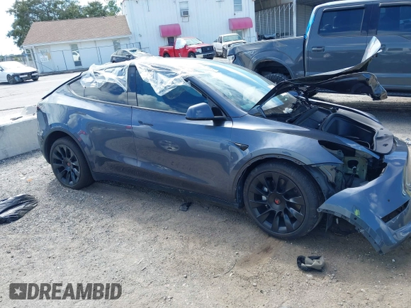 2022 Tesla Model Y Long Range z VIN 7SAYGDEE8NF443194, wystawiony jako IAAI lot #42259205 z przebiegiem 38 540 mil mil oraz . Historia ofert i sprzedaży dostępna na DreamBid. Obrazek 13.