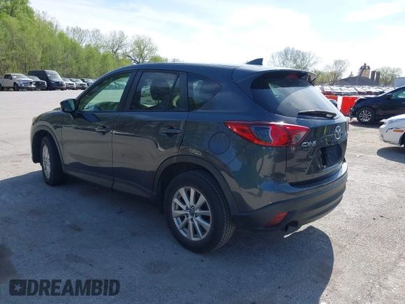 2016 Mazda CX-5 Touring z VIN JM3KE2CY4G0708972, wystawiony jako IAAI lot #42043013 z przebiegiem 157 573 mil mil oraz . Historia ofert i sprzedaży dostępna na DreamBid. Obrazek 3.