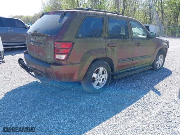 2007 Jeep Grand Cherokee Laredo with VIN 1J8HR48P07C694448, listed as a IAAI auction lot 41956077 with 232,366 mi miles. Bid and sale history available at carsss.com. Image 4.