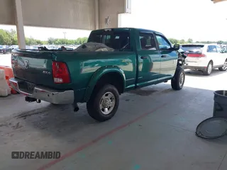2014 Ram 2500 Big Horn with VIN 3C6UR5DLXEG150779, listed as a IAAI auction lot 42254622 with 199,510 mi miles and . Bid and sale history available at DreamBid. Image 4.