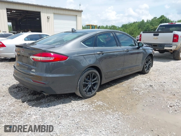2020 Ford Fusion SE z VIN 3FA6P0HD6LR160147, wystawiony jako IAAI lot #42499983 z przebiegiem 73 971 mil mil oraz . Historia ofert i sprzedaży dostępna na DreamBid. Obrazek 4.