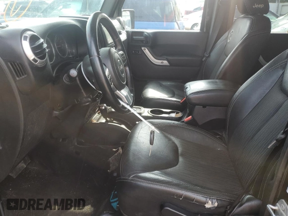 2015 Jeep Wrangler Unlimited Freedom with VIN 1C4BJWDG4FL568601, listed as a Copart auction lot 64041415 with 128,874 mi miles and Salvage title. Bid and sale history available at DreamBid. Image 7.