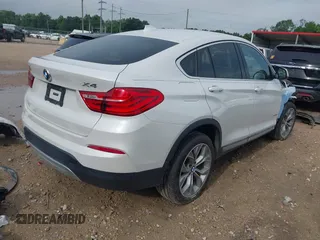2015 BMW X4 xDrive28i with VIN 5UXXW3C51F0M86668, listed as a IAAI auction lot 42489071 with 59,694 mi miles and . Bid and sale history available at DreamBid. Image 4.