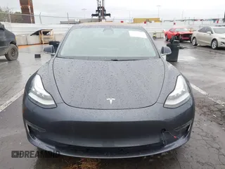 2018 Tesla Model 3 Long Range Battery with VIN 5YJ3E1EB7JF114305, listed as a IAAI auction lot 41765994 with 76,945 mi miles and . Bid and sale history available at DreamBid. Image 13.