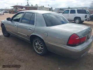 1998 Mercury Grand Marquis LS with VIN 2MEFM75W8WX687967, listed as a IAAI auction lot 41626058 with 135,183 mi miles. Bid and sale history available at carsss.com. Image 3.