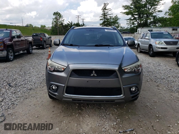 2011 Mitsubishi Outlander SE z VIN JA4AP4AU7BZ013457, wystawiony jako Copart lot #58860505 z przebiegiem 221 993 mil mil oraz Szkoda całkowita • Salvage title. Historia ofert i sprzedaży dostępna na DreamBid. Obrazek 5.