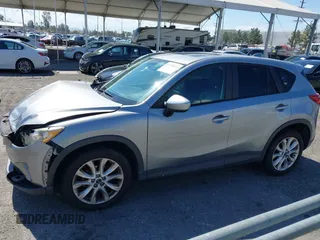 2014 Mazda CX-5 Grand Touring with VIN JM3KE2DY0E0331942, listed as a IAAI auction lot 41750533 with 163,387 mi miles. Bid and sale history available at carsss.com. Image 14.