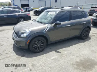 2011 MINI Countryman S with VIN WMWZC5C5XBWL55516, listed as a Copart auction lot 63239235 with 137,545 mi miles and Salvage title. Bid and sale history available at DreamBid. Image 1.