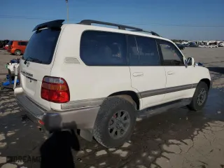1999 Toyota Land Cruiser with VIN JT3HT05J8X0049750, listed as a Copart auction lot 77547144 with 168,435 mi miles and Salvage Title. Bid and sale history available at carsss.com. Image 3.