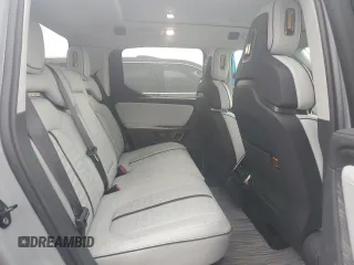 2022 Rivian R1T Adventure z VIN 7FCTGAAA0NN014488, wystawiony jako Copart lot #51024514 z przebiegiem 18 721 mil mil oraz Szkody całkowita. Historia ofert i sprzedaży dostępna na DreamBid. Obrazek 10.