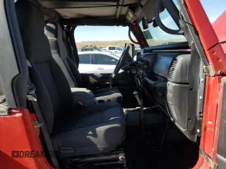 2003 Jeep Wrangler Rubicon z VIN 1J4FA69S93P352899, wystawiony jako Copart lot #56054425 z przebiegiem 3761 mil mil oraz Szkoda całkowita • Salvage title. Historia ofert i sprzedaży dostępna na DreamBid. Obrazek 10.