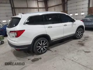 2022 Honda Pilot Touring 7-Passenger with VIN 5FNYF6H63NB063857, listed as a IAAI auction lot 41936941 with 54,424 mi miles. Bid and sale history available at carsss.com. Image 4.