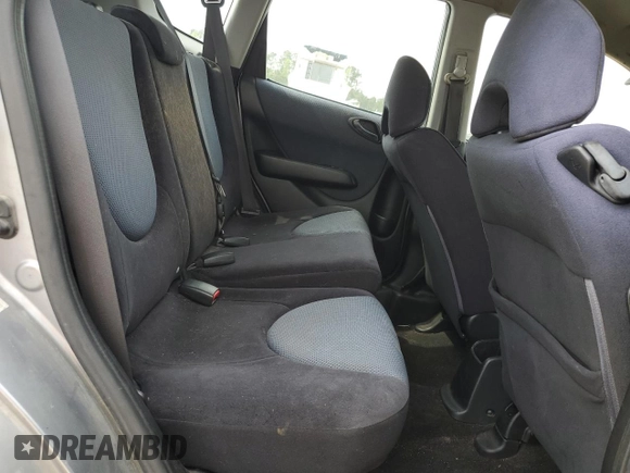 2007 Honda Fit z VIN JHMGD38427S021652, wystawiony jako Copart lot #52692775 z przebiegiem 178 416 mil mil oraz Szkoda całkowita • Salvage title. Historia ofert i sprzedaży dostępna na DreamBid. Obrazek 10.
