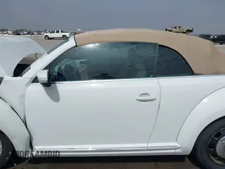 2015 Volkswagen Beetle 1.8T w/Tech with VIN 3VW517AT4FM812294, listed as a IAAI auction lot 41753967 with 59,857 mi miles and . Bid and sale history available at DreamBid. Image 14.