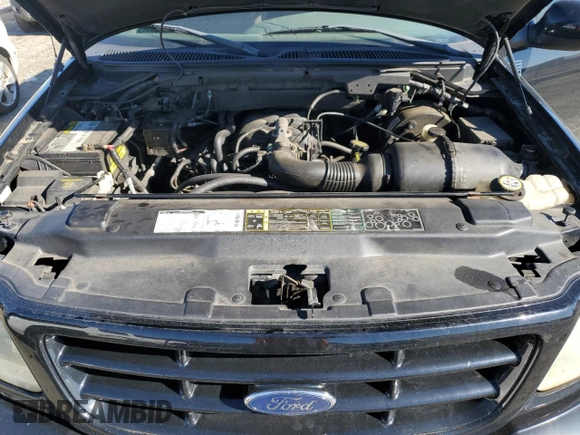 2002 Ford F-150 XL with VIN 1FTRF18232NA58109, listed as a Copart auction lot 79080674 with 148,213 mi miles and Salvage title. Bid and sale history available at DreamBid. Image 11.