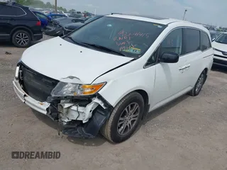 2012 Honda Odyssey EX-L with VIN 5FNRL5H62CB059481, listed as a IAAI auction lot 42241415 with 135,244 mi miles and . Bid and sale history available at DreamBid. Image 2.