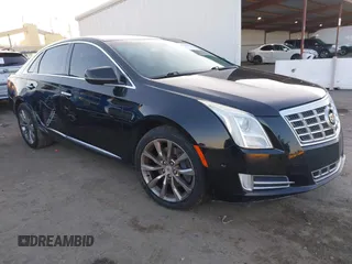 2015 Cadillac XTS Luxury z VIN 2G61M5S34F9114257, wystawiony jako IAAI lot #41354491 z przebiegiem 65 951 mil mil oraz . Historia ofert i sprzedaży dostępna na DreamBid. Obrazek 1.