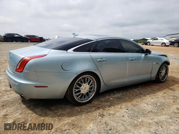 2013 Jaguar XJ with VIN SAJWA1C77D8V41738, listed as a Copart auction lot 53796225 with 104,063 mi miles and Salvage Title. Bid and sale history available at DreamBid. Image 3.