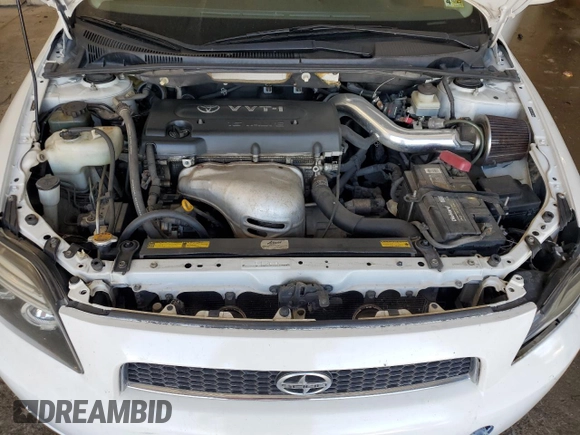 2005 Scion tC z VIN JTKDE177650011368, wystawiony jako Copart lot #56408015 z przebiegiem 165 731 mil mil oraz Szkoda całkowita • Salvage title. Historia ofert i sprzedaży dostępna na DreamBid. Obrazek 11.