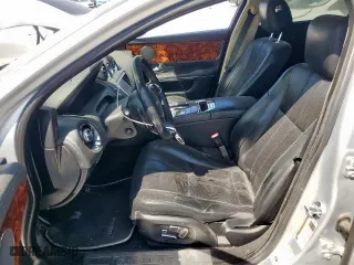 2012 Jaguar XJ with VIN SAJWA1CB0CLV23002, listed as a Copart auction lot 52804915 with 149,331 mi miles and Salvage Title. Bid and sale history available at carsss.com. Image 7.