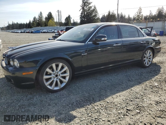 2008 Jaguar XJ with VIN SAJWA79BX8SH23430, listed as a Copart auction lot 51990785 with 140,454 mi miles and Salvage Title. Bid and sale history available at carsss.com. Image 1.