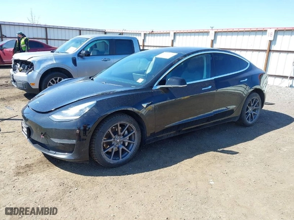 2019 Tesla Model 3 Mid Range with VIN 5YJ3E1EA3KF304286, listed as a IAAI auction lot 42066908 with 164,667 mi miles. Bid and sale history available at carsss.com. Image 2.
