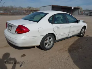 2003 Ford Taurus SE Standard with VIN 1FAFP53U73A107231, listed as a IAAI auction lot 41826418 with 123,774 mi miles. Bid and sale history available at carsss.com. Image 4.