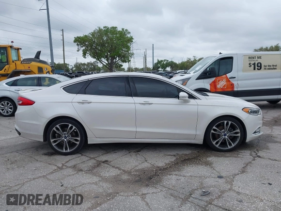 2017 Ford Fusion Titanium with VIN 3FA6P0K99HR272713, listed as a IAAI auction lot 41757334 with 104,733 mi miles. Bid and sale history available at carsss.com. Image 13.