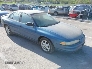 1998 Oldsmobile Intrigue GX z VIN 1G3WH52KXWF393882, wystawiony jako IAAI lot #42056782 z przebiegiem 223 763 mil mil oraz . Historia ofert i sprzedaży dostępna na DreamBid. Obrazek 1.