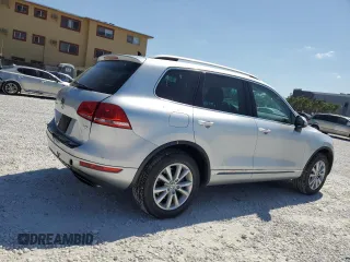 2014 Volkswagen Touareg Sport with VIN WVGEF9BP8ED005445, listed as a Copart auction lot 53694215 with 194,711 mi miles and Salvage Title. Bid and sale history available at DreamBid. Image 3.