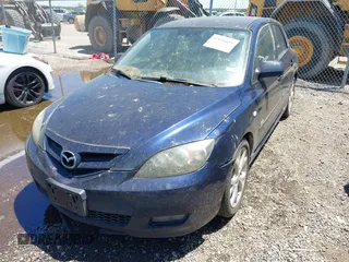 2009 Mazda Mazda3 s Touring with VIN JM1BK343091203101, listed as a IAAI auction lot 42036616 with 140,755 mi miles. Bid and sale history available at carsss.com. Image 2.