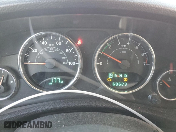 2012 Jeep Wrangler Sport z VIN 1C4AJWAG9CL150787, wystawiony jako Copart lot #50863415 z przebiegiem 68 623 mil mil oraz Szkoda całkowita • Salvage title. Historia ofert i sprzedaży dostępna na DreamBid. Obrazek 9.